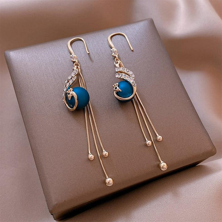 Boucles d'oreilles avec perles bleues pour les fêtes