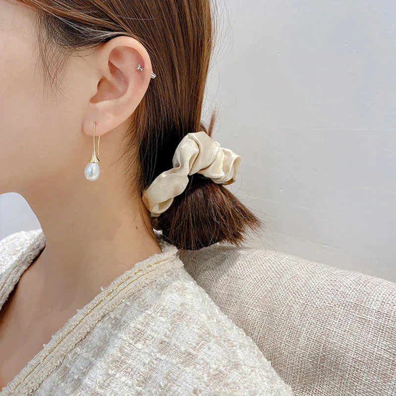 Boucles d'oreilles pendantes avec perles