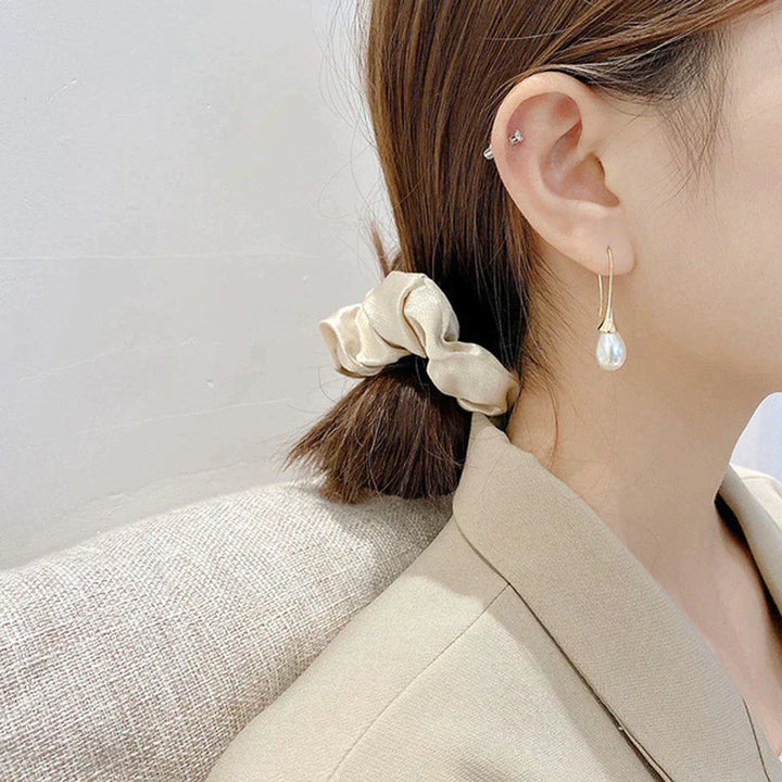 Boucles d'oreilles pendantes avec perles